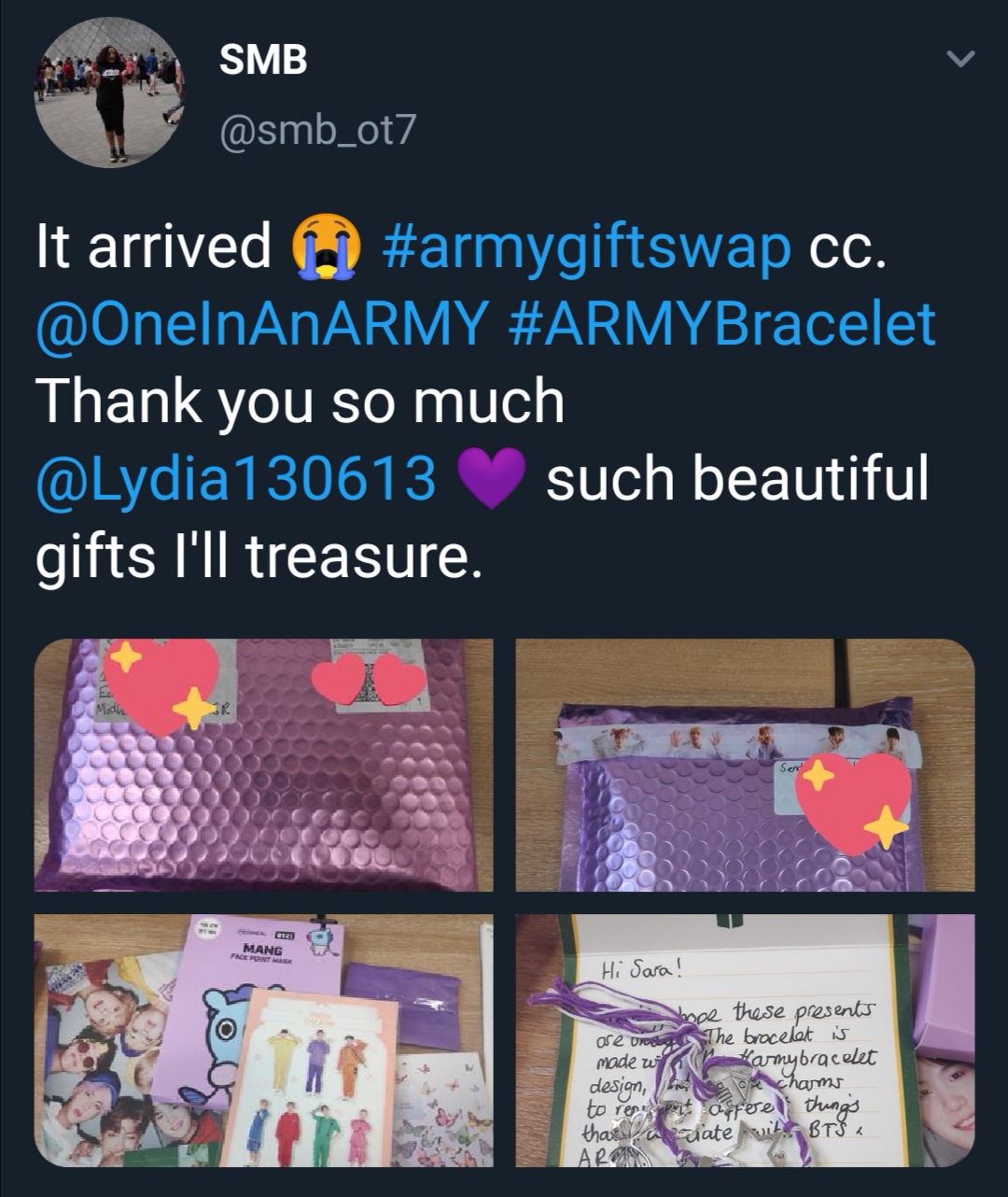 Tweet showing what an ARMY received from the ARMY Gift Swap. The photos show a purple bubble mailer that contained a Mang face mask, BTS merch, and an ARMY friendship bracelet