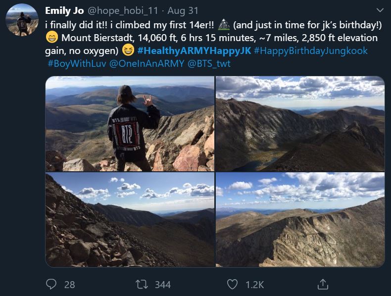 Tweet showing an ARMY participating in the bonus mission Healthy ARMY Happy Jungkook. The tweet states that the ARMY climbed Mount Bierstadt which is a 7 mile hike. The tweet includes pictures that show the ARMY from behind, wearing a black jacket with BTS written on the back, while they look out over Mount Bierstadt. The ARMY is making the American Sign Language sign for love with their right hand.