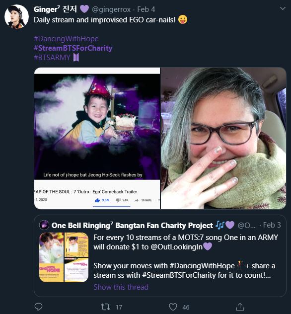 Tweet showing the ARMY streaming the Ego music video. The ARMY included a photo of themselves doing the three finger pose from the Ego choreography. The ARMY has blue grey hair styled in a pixie cut on one side and a nose length fringe on the other side.